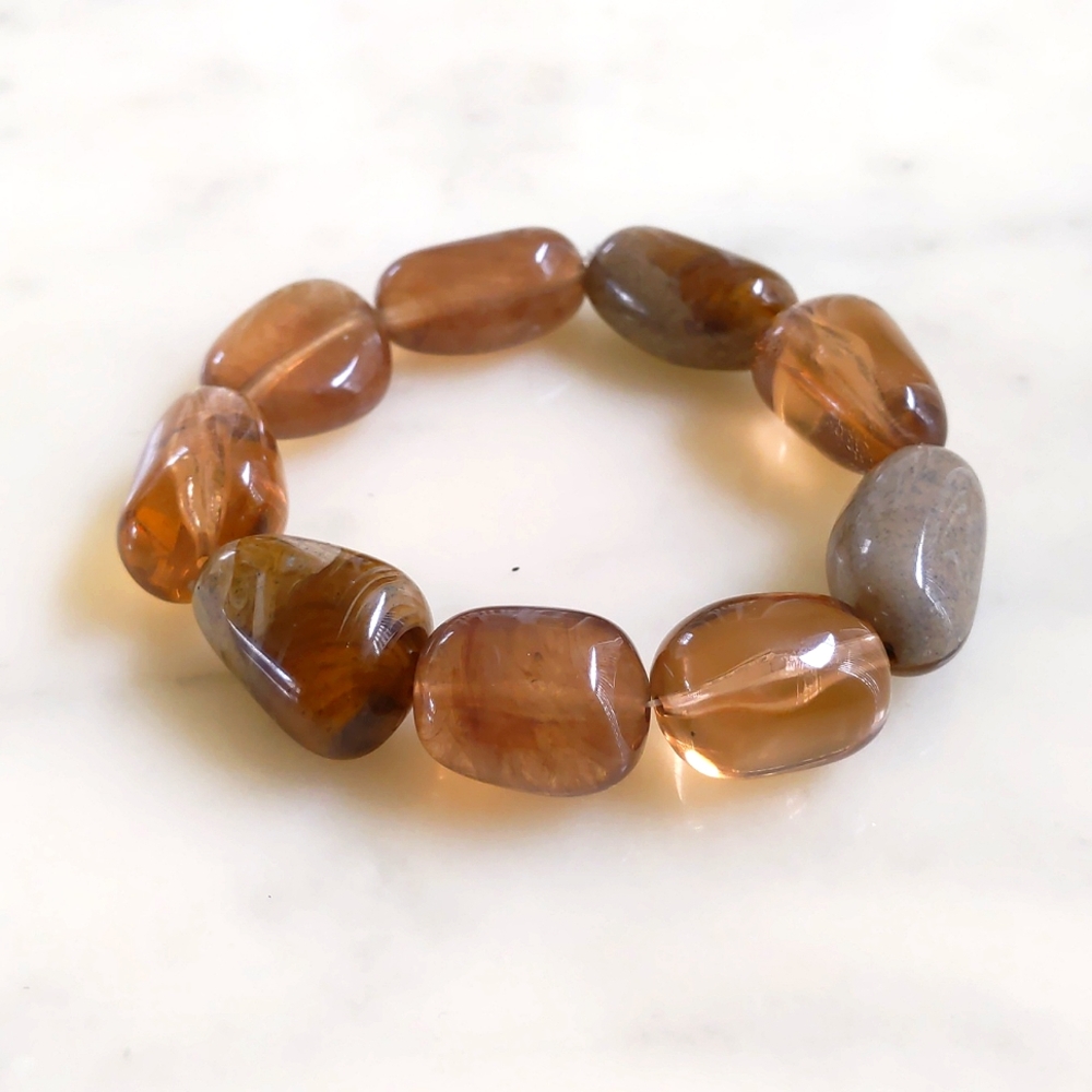 NWOT. The Limited Multi Shades of Brown and Shapes Stretchable Bracelet.